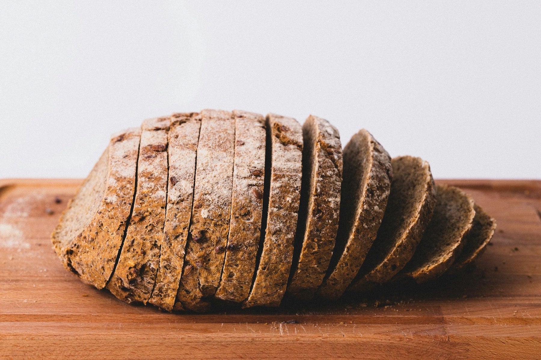Sliced rye loaf on a wooden board