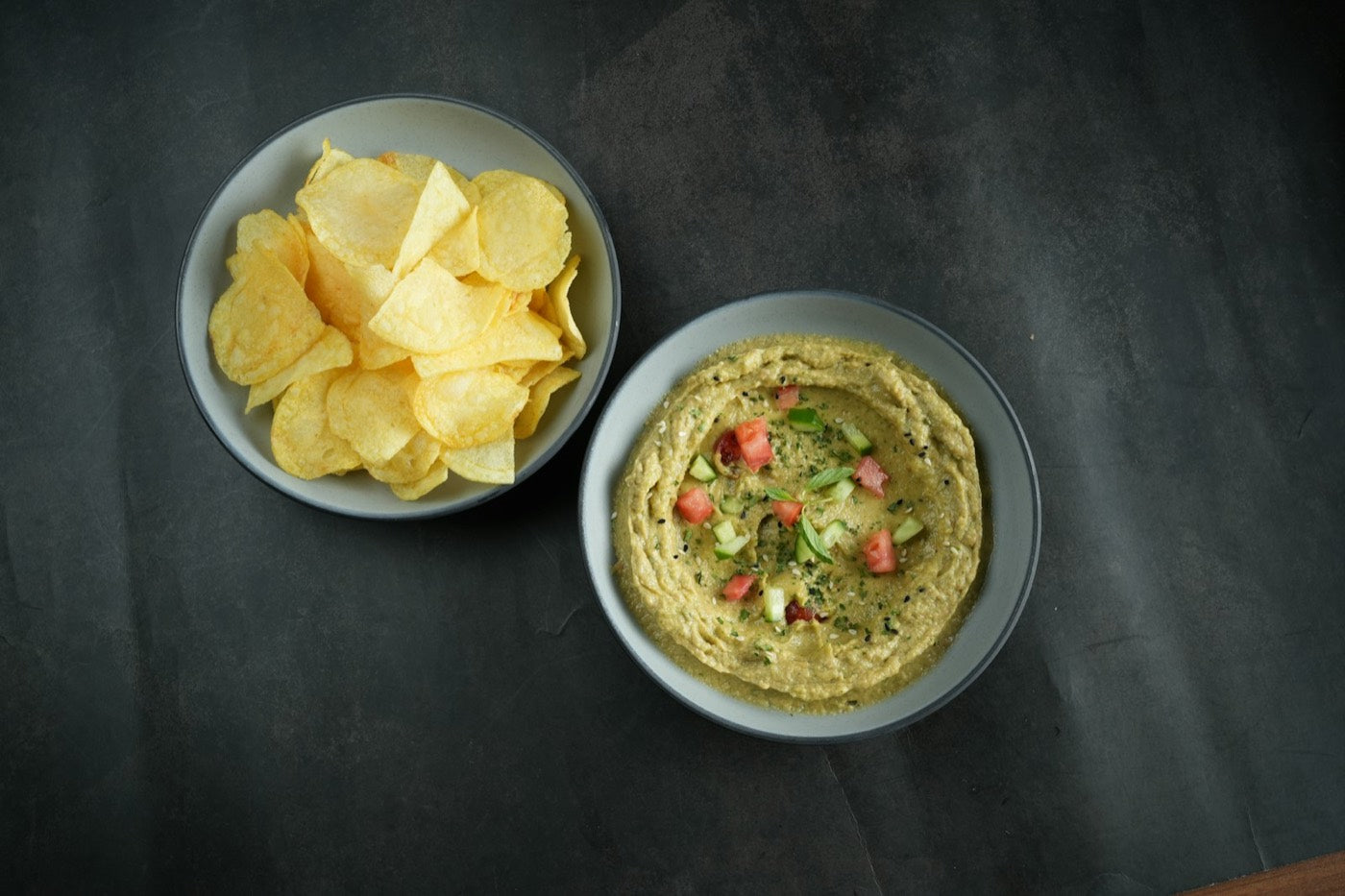Bowls of crisps and dip